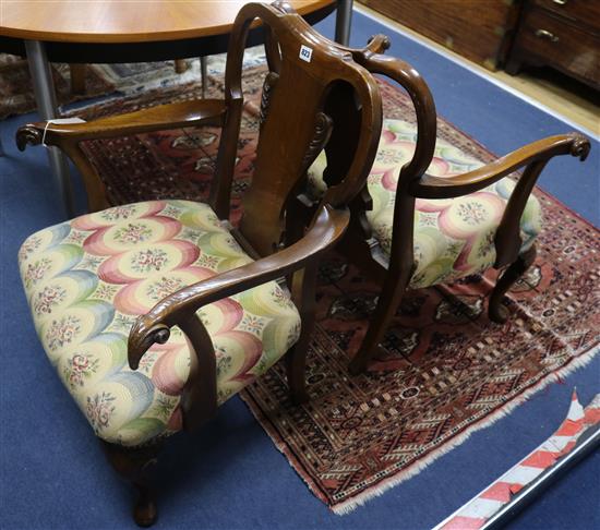 A pair of George II style oak armchairs